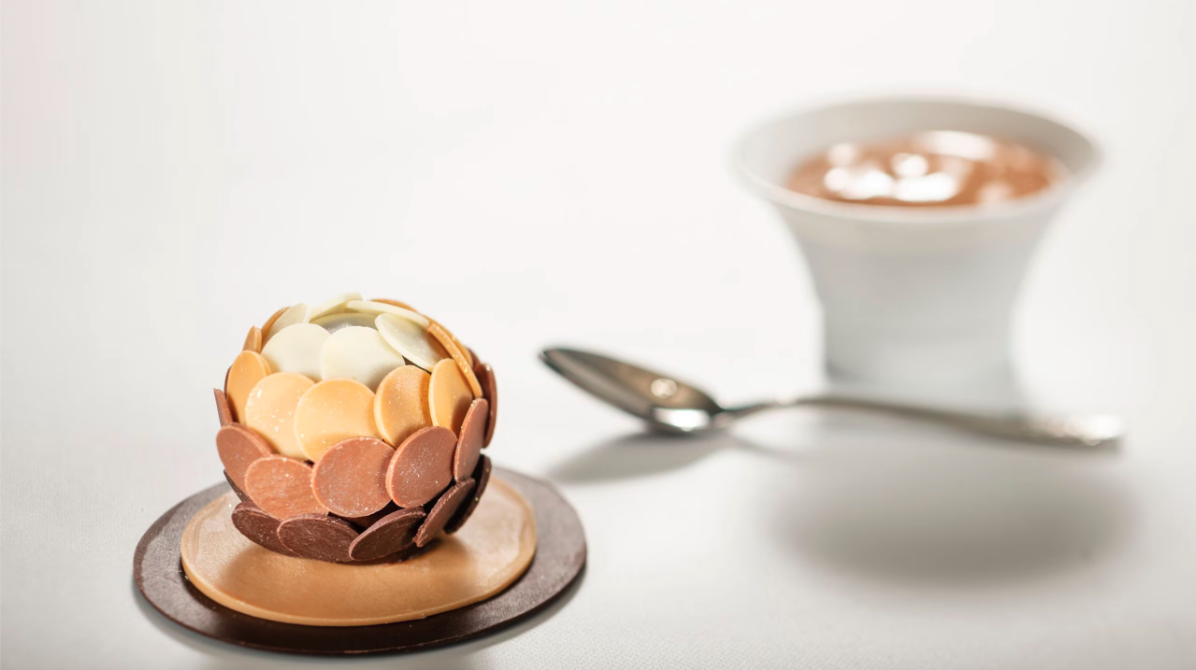 dessert with a ball of brown to white chocolate coins and coffee
